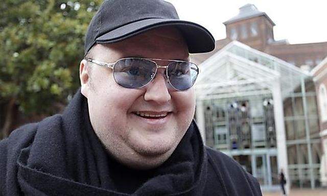 Megaupload founder Kim Dotcom talks to members of the media as he leaves the High Court in Auckland