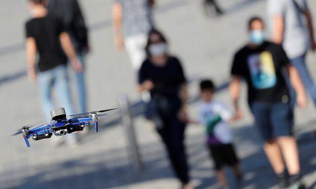 Police drone fitted with a megaphone speaker flies over the Taksim Square in Istanbul