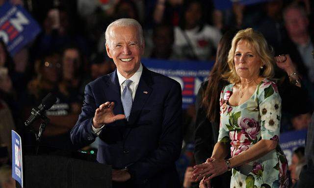 Democratic presidential candidate Vice President Joe Biden and his wife Dr. Jill Biden smile as supporters greet them a
