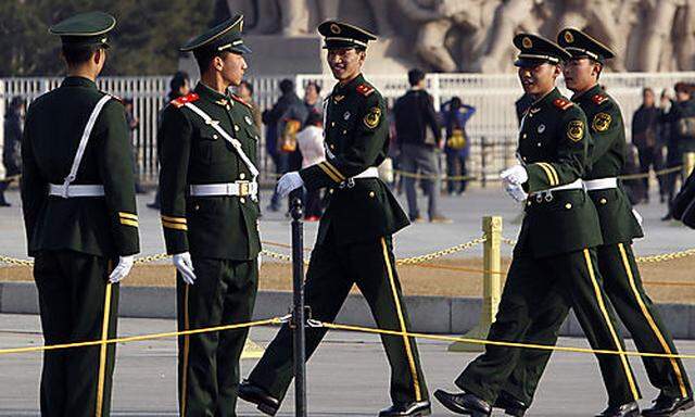 Chinese paramilitary police patrol Tiananmen Square in Beijing, Friday, March 4, 2011.  China will bo