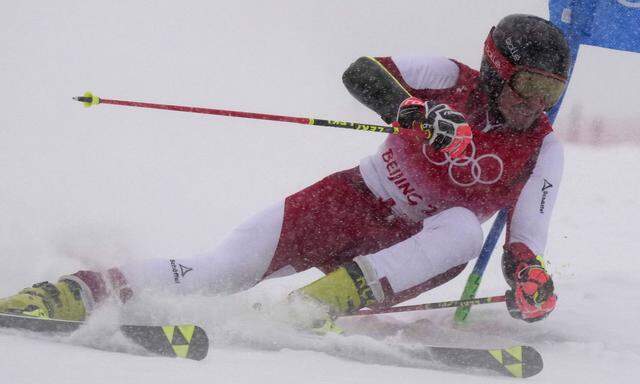 Stefan Brennsteiner of Austria skis in a driving snowstorm to the second best time in the first heat of the men s Giant