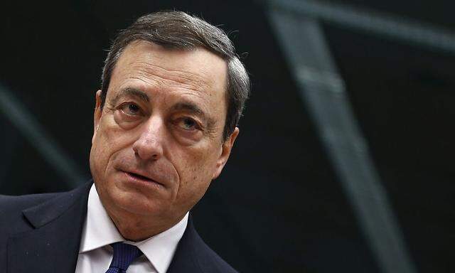 European Central Bank President Draghi looks on at the start of an Eurozone finance ministers meeting in Brussels