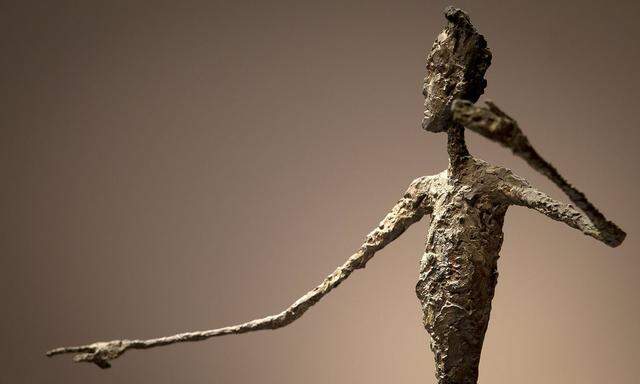 The top half of Alberto Giacometti's 'L'homme Au Doigt' (Pointing man) sculpture is pictured at Christie's Auction House in the Manhattan borough of New York