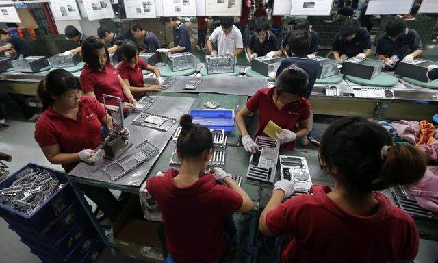 File photo of employees working at a Foxconn factory in Wuhan