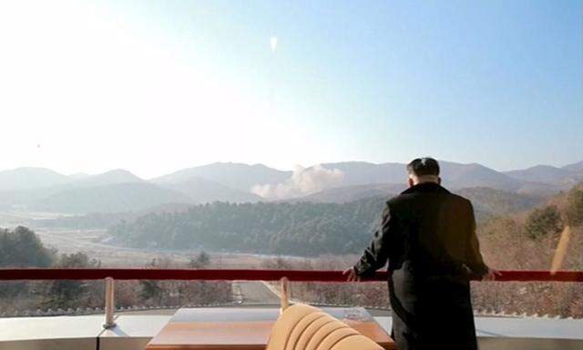 North Korean leader Kim Jong Un watches a long range rocket launched into the air in this still image taken from KRT footage and released by Yonhap