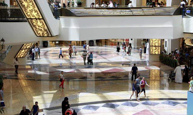 People shop at the Mall of the Emirates in Dubai