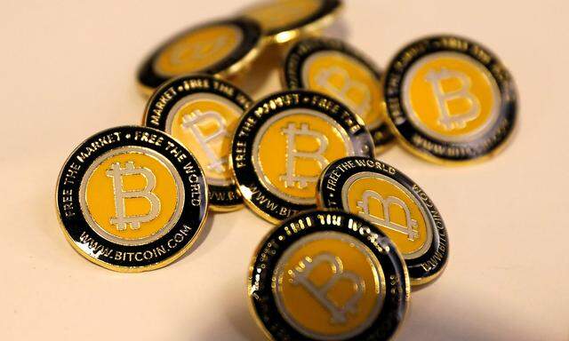 FILE PHOTO: Bitcoin.com buttons are seen displayed on the floor of the Consensus 2018 blockchain technology conference in New York City