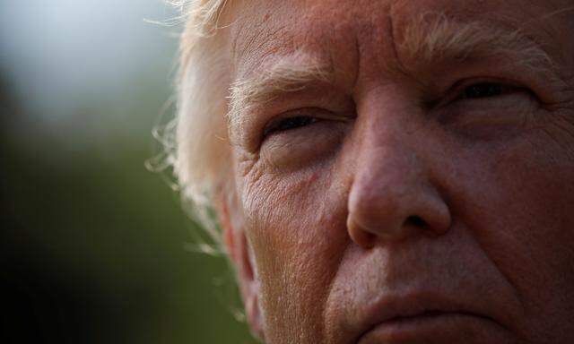 U.S. President Donald Trump talks with reporters as he departures the Oval Office of the White House for Indianapolis, in Washington D.C., U.S.