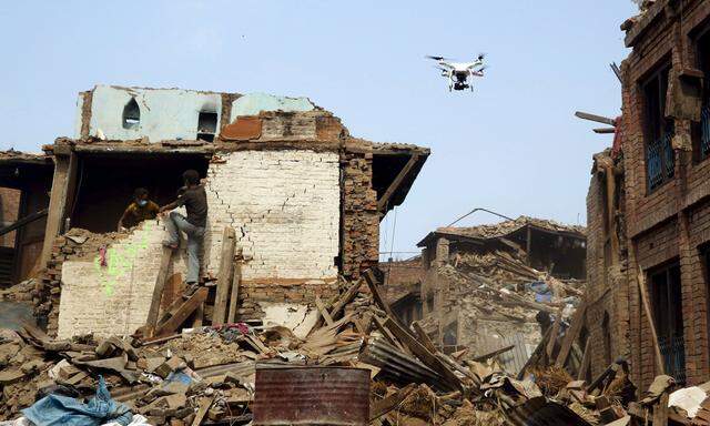 A drone flies over buildings destroyed after last week´s earthquake in Bhaktapur