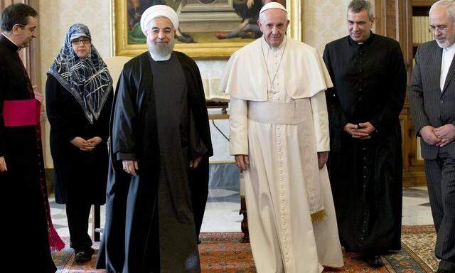 Iran President Rouhani walks with Pope Francis at the Vatican