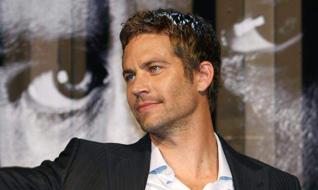 U.S. actor Walker smiles during the premiere of the movie ´Fast and Furious 4´ in Taiwan
