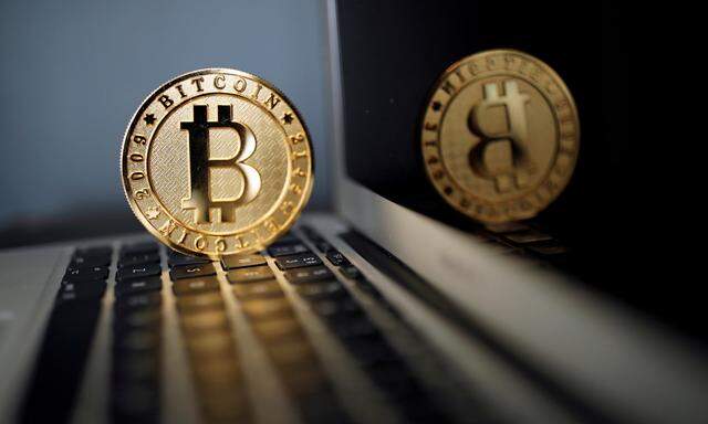 FILE PHOTO: A Bitcoin (virtual currency) coin is seen in an illustration picture taken at La Maison du Bitcoin in Paris