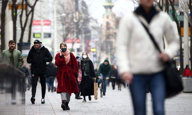 People with protective masks walk down a shopping street during the second lockdown as the coronavirus disease (COVID-19) outbreak continues in Vienna
