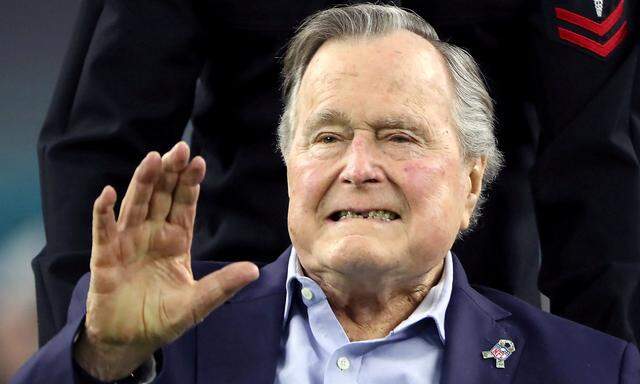 FILE PHOTO: Former U.S. President George H.W. Bush arrives on the field ahead of the start of Super Bowl LI in Houston
