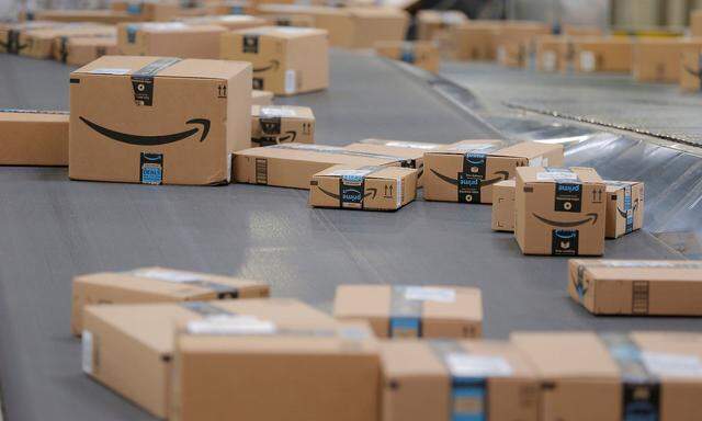 Packages travel along a conveyor belt inside of an Amazon fulfillment center in Robbinsville, New Jersey