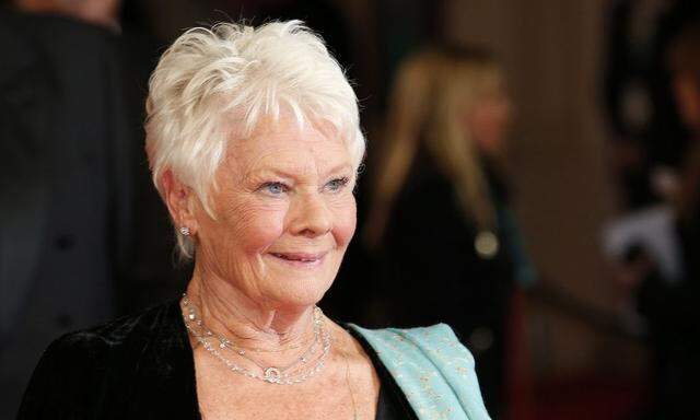 Actress Judi Dench arrives at the British Academy of Film and Arts awards ceremony at the Royal Opera House in London