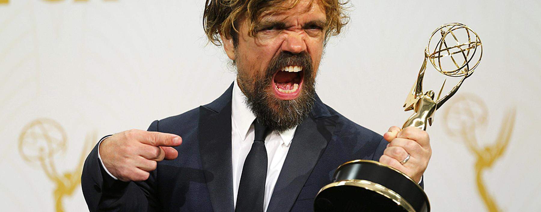 Peter Dinklage poses with his award during the 67th Primetime Emmy Awards in Los Angeles