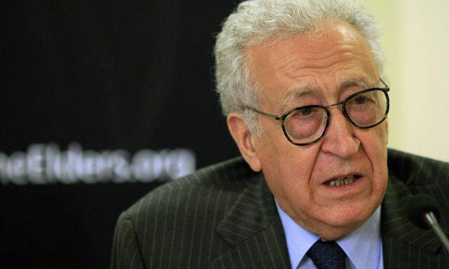 Diplomat Lakhdar Brahimi speaks with former U.S. President Jimmy Carter (not pictured) during a joint news conference in Khartoum