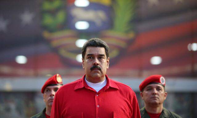 Venezuela's President Nicolas Maduro receives military honors at Maiquetia airport, in Caracas