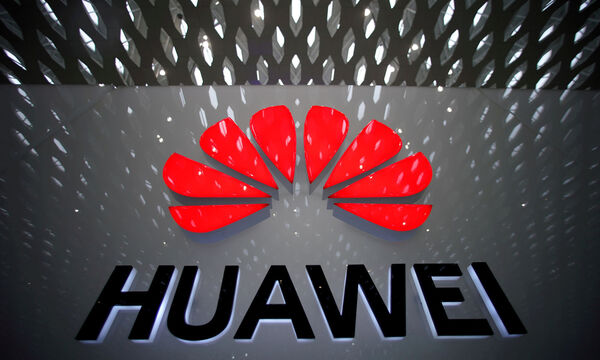 FILE PHOTO: A Huawei company logo is pictured at the Shenzhen International Airport in Shenzhen, China