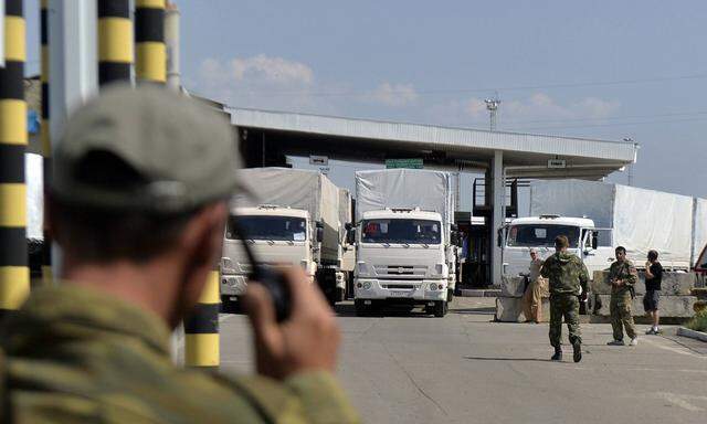 ITAR TASS LUGANSK REGION UKRAINE AUGUST 22 2014 Trucks of a Russian convoy carrying humanitaria