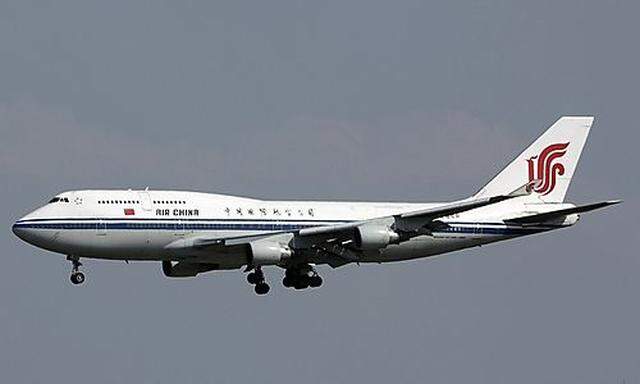 An Air China Boeing 747 passenger jet lands at the Beijing Capital Airport