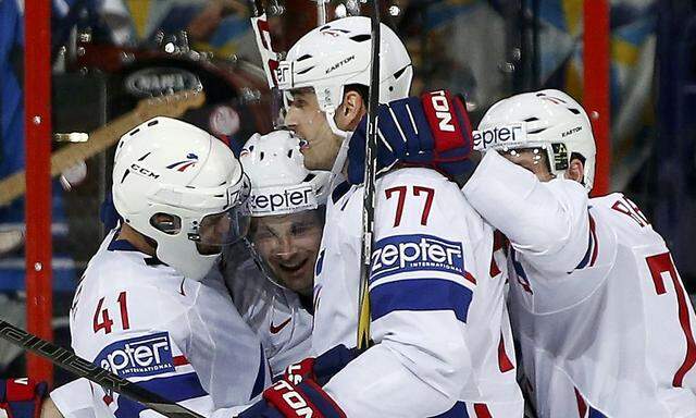 France's players celebrate their goal against Russia during their 2013 IIHF Ice Hockey World Championship preliminary round match at the Hartwall Arena in Helsinki 