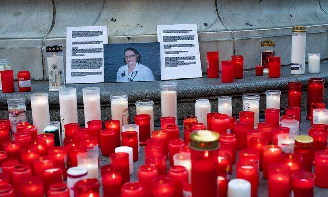 linz, austria, 01 aug 2022, flowers and burning candles lie at a memorial in memory of upper austrian doctor Lisa-Maria