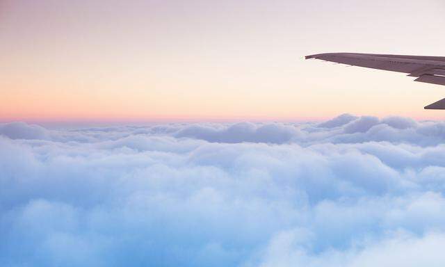 Soft clouds blanket the sky during flight