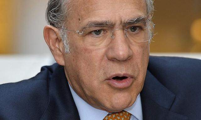 OECD Secretary-General Angel Gurria briefs media on dangers of U.S. political impasse to world economy, during IMF and World Bank's 2013 Annual Fall Meetings, in Washington