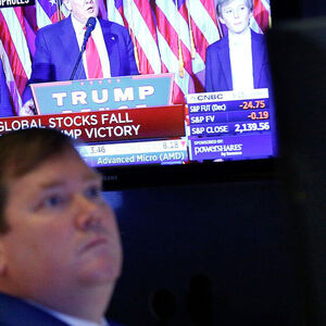 Trader works on the floor of the NYSE 