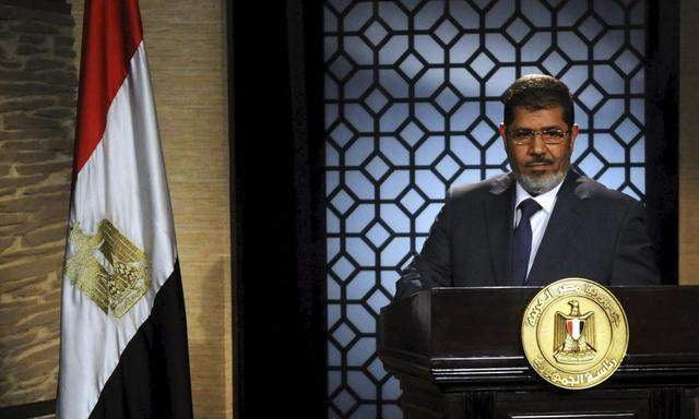 File picture shows Egyptian Muslim Brotherhood then president-elect Mohamed Mursi speaking during his first televised address to the nation, in Cairo