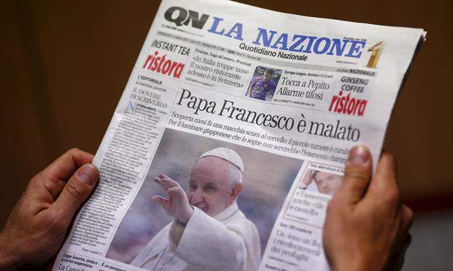 A man reads the Italian newspaper ´Quotidiano Nazionale´ in Rome