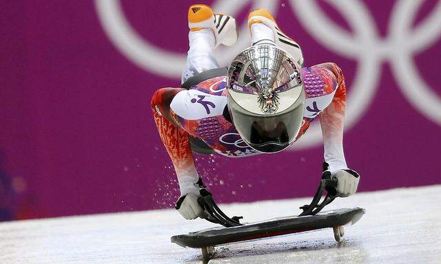 Austria's Janine Flock pushes off during the women's skeleton event at the 2014 Sochi Winter Olympics at the Sanki Sliding Center