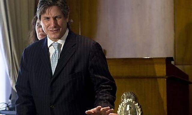 File photo of Argentinas Economy Minister Amado Boudou smiling during a meeting with the media at ths Economy Minister Amado Boudou smiling during a meeting with the media at th