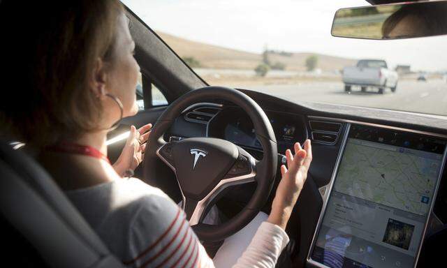 New Autopilot features are demonstrated in a Tesla Model S during a Tesla event in Palo Alto, California