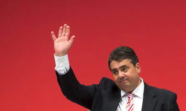 Party leader of the Social Democratic Party Gabriel waves to delegates after his speech during an SPD party congress in Leipzig
