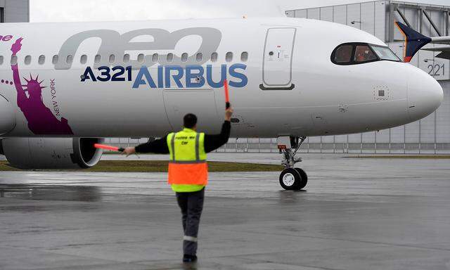 An Airbus A321LR arrives after its maiden flight during a presentation of the company's new long range aircraft in Hamburg-Finkenwerder