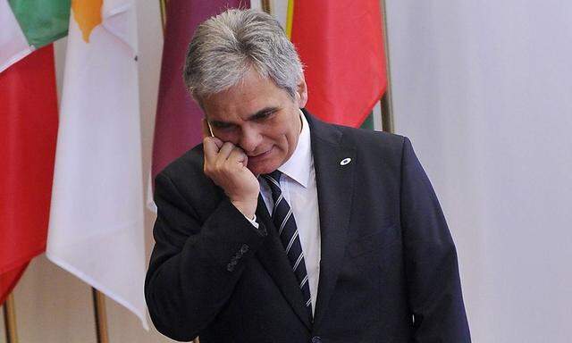 Austria's Chancellor Faymann arrives at the EU council headquarters for an European Union leaders summit meeting to discuss the European Union's long-term budget in Brussels