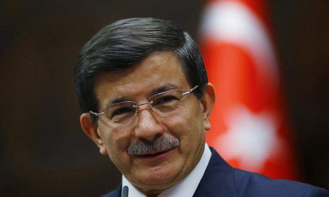 Turkey´s Prime Minister Ahmet Davutoglu addresses members of parliament from his ruling AK Party (AKP) during a meeting at the Turkish parliament in Ankara