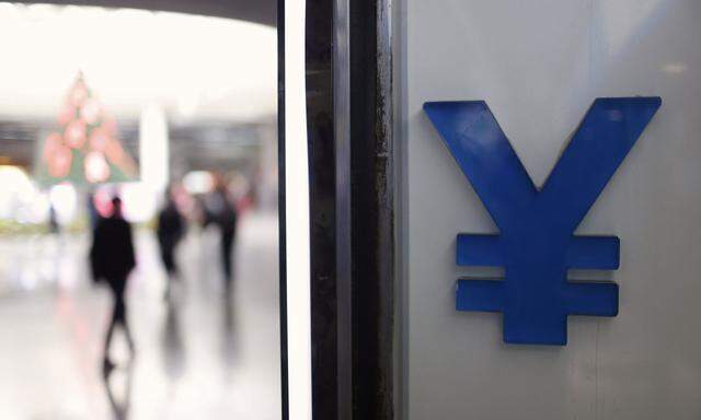 FILE PHOTO -  A logo of yuan is seen at a foreign exchange store in Shanghai