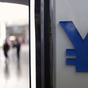 FILE PHOTO -  A logo of yuan is seen at a foreign exchange store in Shanghai