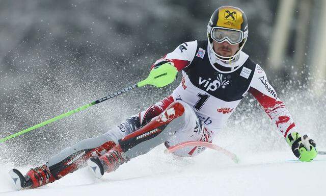 Hirscher of Austria clears a pole during the first slalom run of the men's Alpine Skiing World Cup in Zagreb