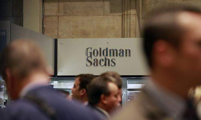File photo of traders working on the floor of the New York Stock Exchange near the Goldman Sachs stall