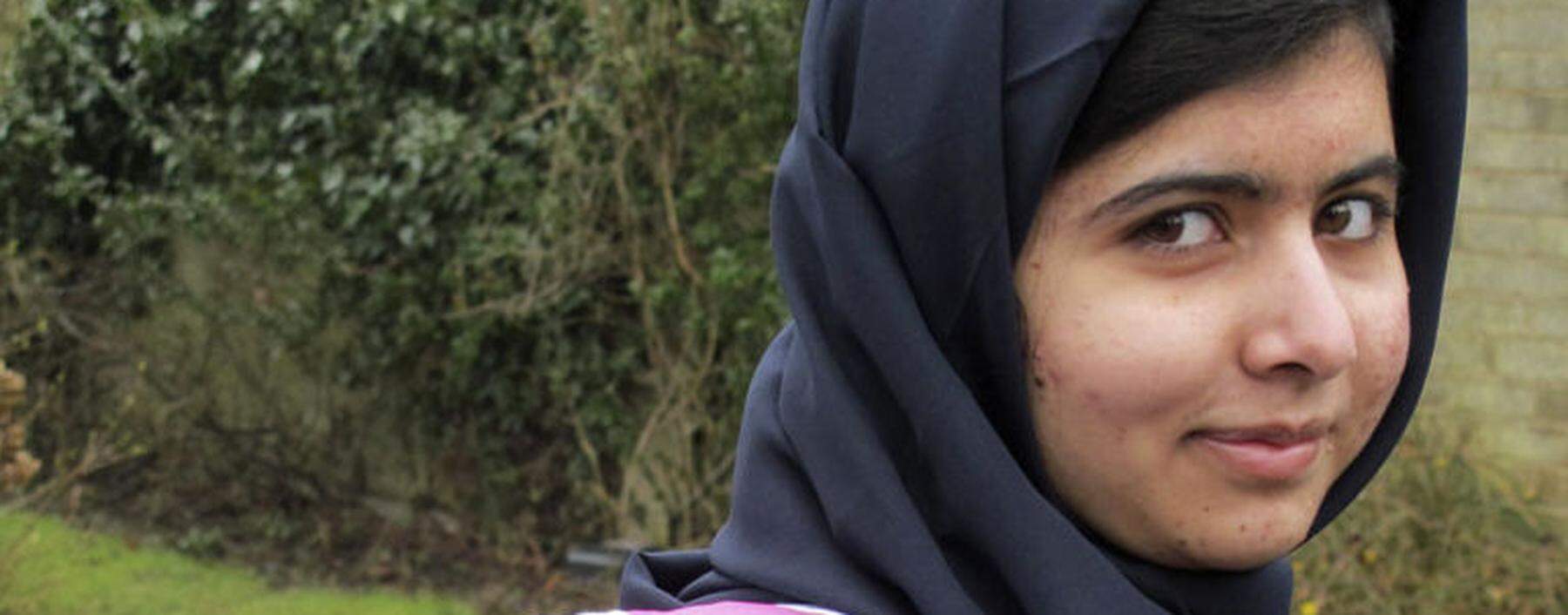 Malala Yousufzai smiles as she attends Edgbaston High School for girls in Edgbaston