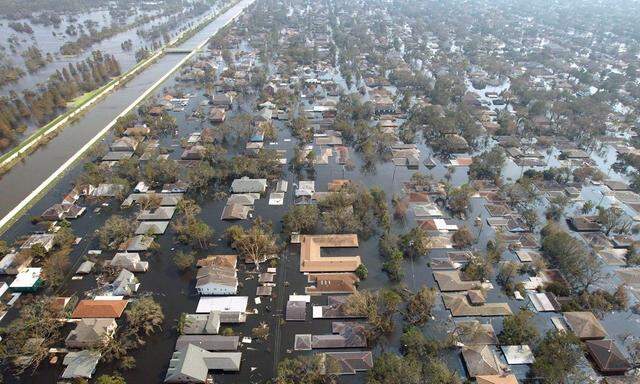 File photo of Louisiana homes near a levee remain under water a week after Hurricane Katrina