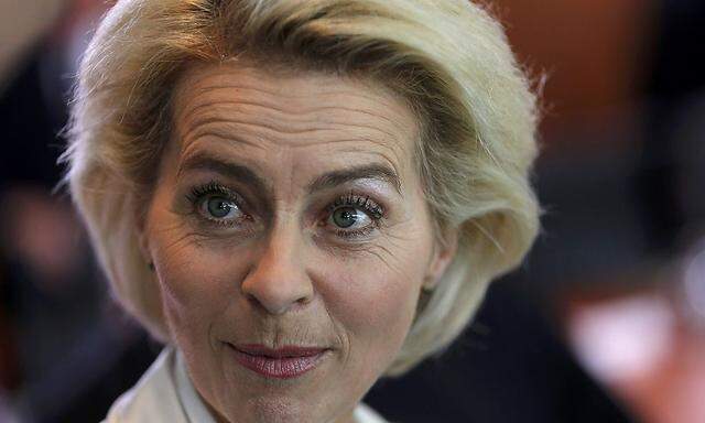 German Defence Minister von der Leyen reacts as she arrives for the weekly cabinet meeting at the Chancellery in Berlin