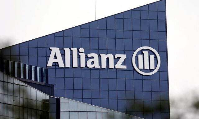 FILE PHOTO: The logo of insurer Allianz SE is seen on the company building in Puteaux at the financial and business district of La Defense near Paris