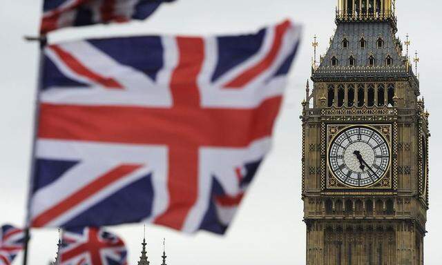 Flags are seen above a souvenir kiosk near Big Ben clock at the Houses of Parliament in central London