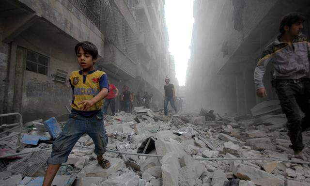 Sept 15 2015 Aleppo Syria Syrians walk on the rubble of buildings after a missile fired by Sy